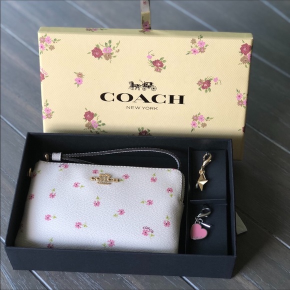 Coach Handbags - Coach white floral wristlet in gift box w/ charms